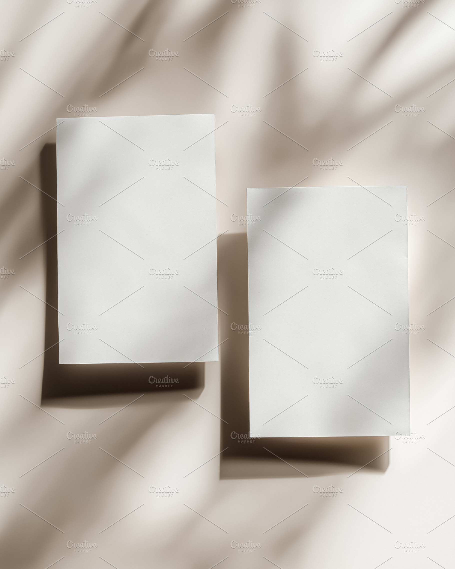 White paper mockups displaying clean design against a warm beige background wit, a Holiday Photo by Studio ANNA