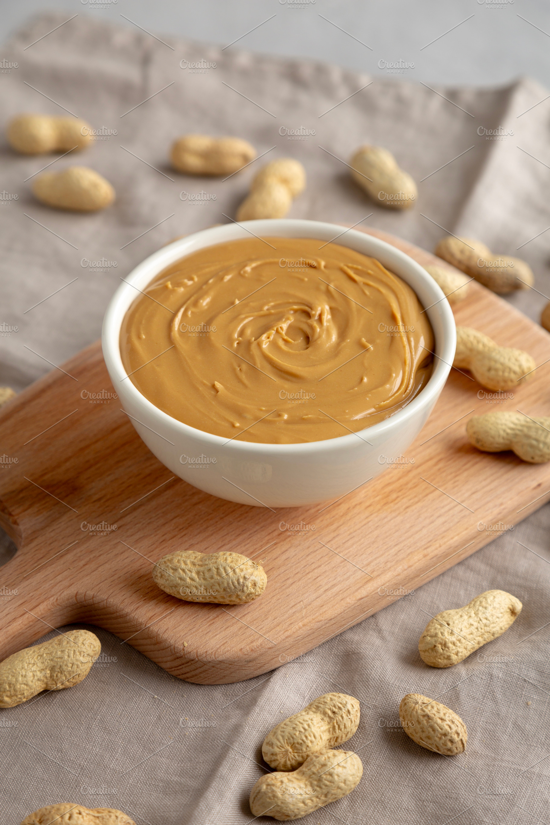 Organic Peanut Butter in a Bowl, side view., a Food & Drink Photo by LiudmylaChuhunova