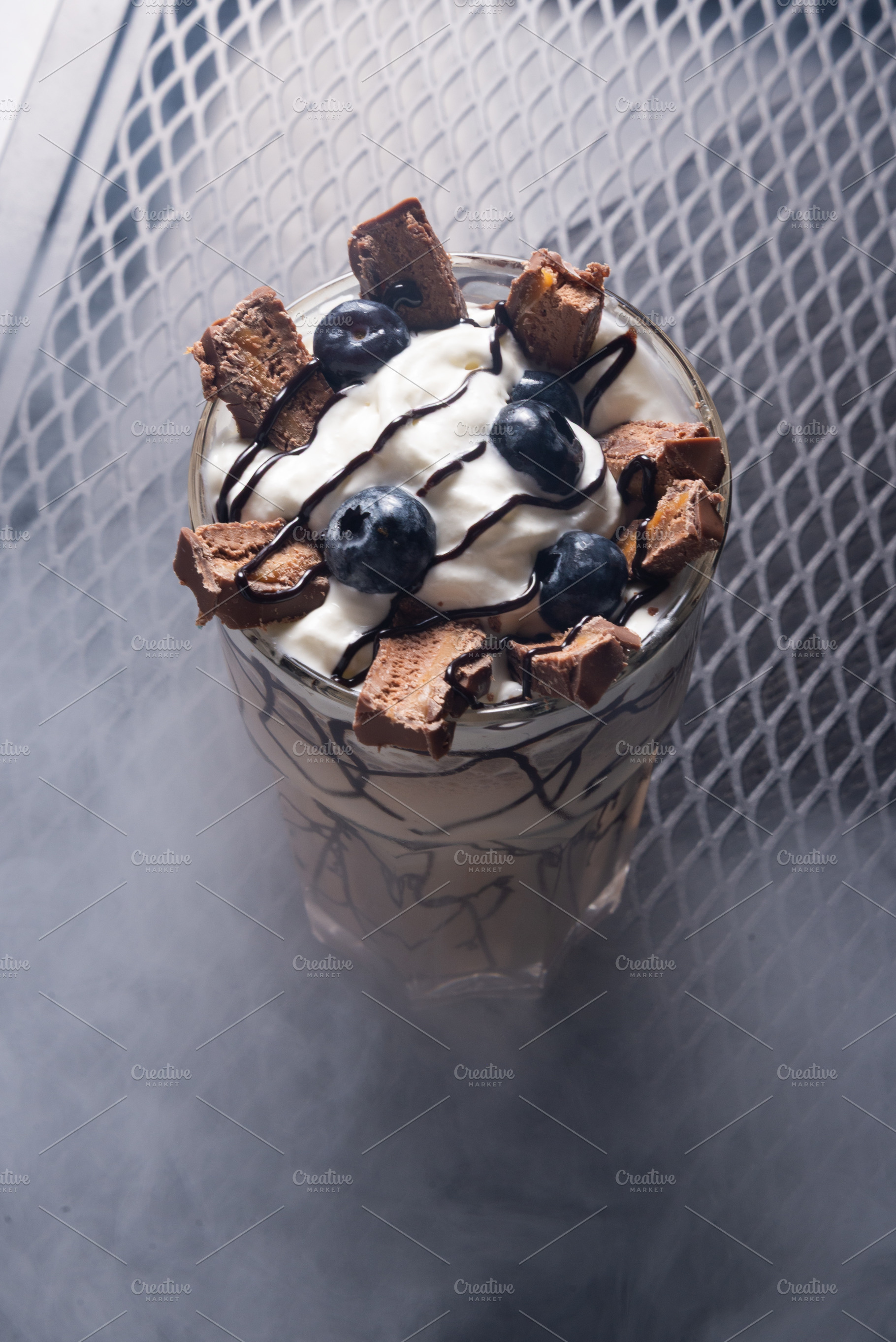 Chocolate Milkshake with Whipped Cream and Chocolate in Glass on, a Photo by MDBildes