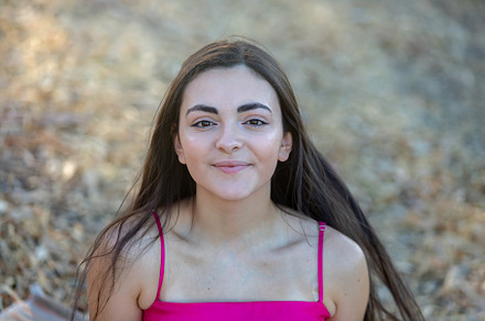 Young hispanic girl smiling happy at the park, a Person Photo by José Manuel Gelpi