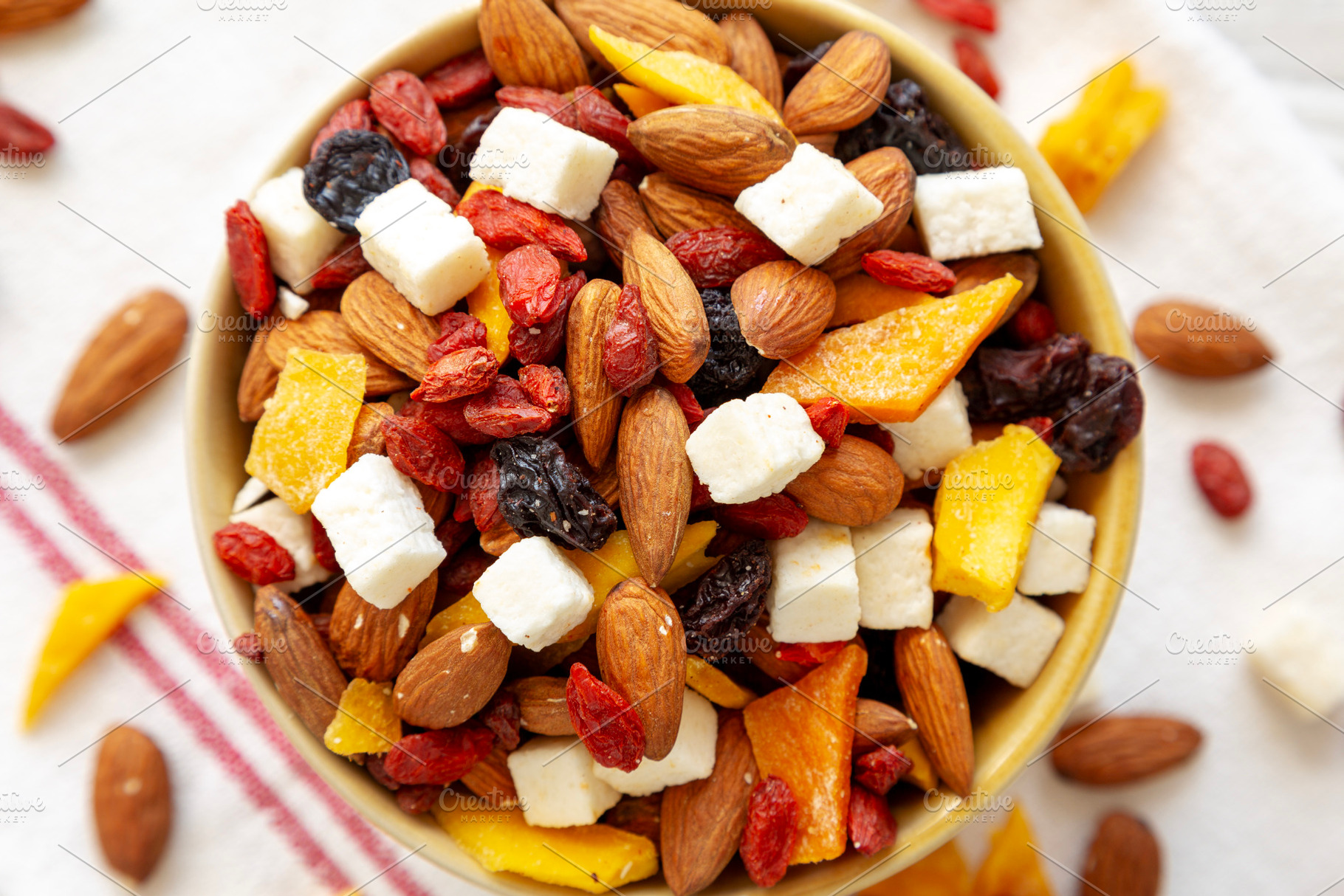 Healthy Dried Fruit and Nut Mix in a Bowl, top view. Close-up., a Food & Drink Photo by LiudmylaChuhunova