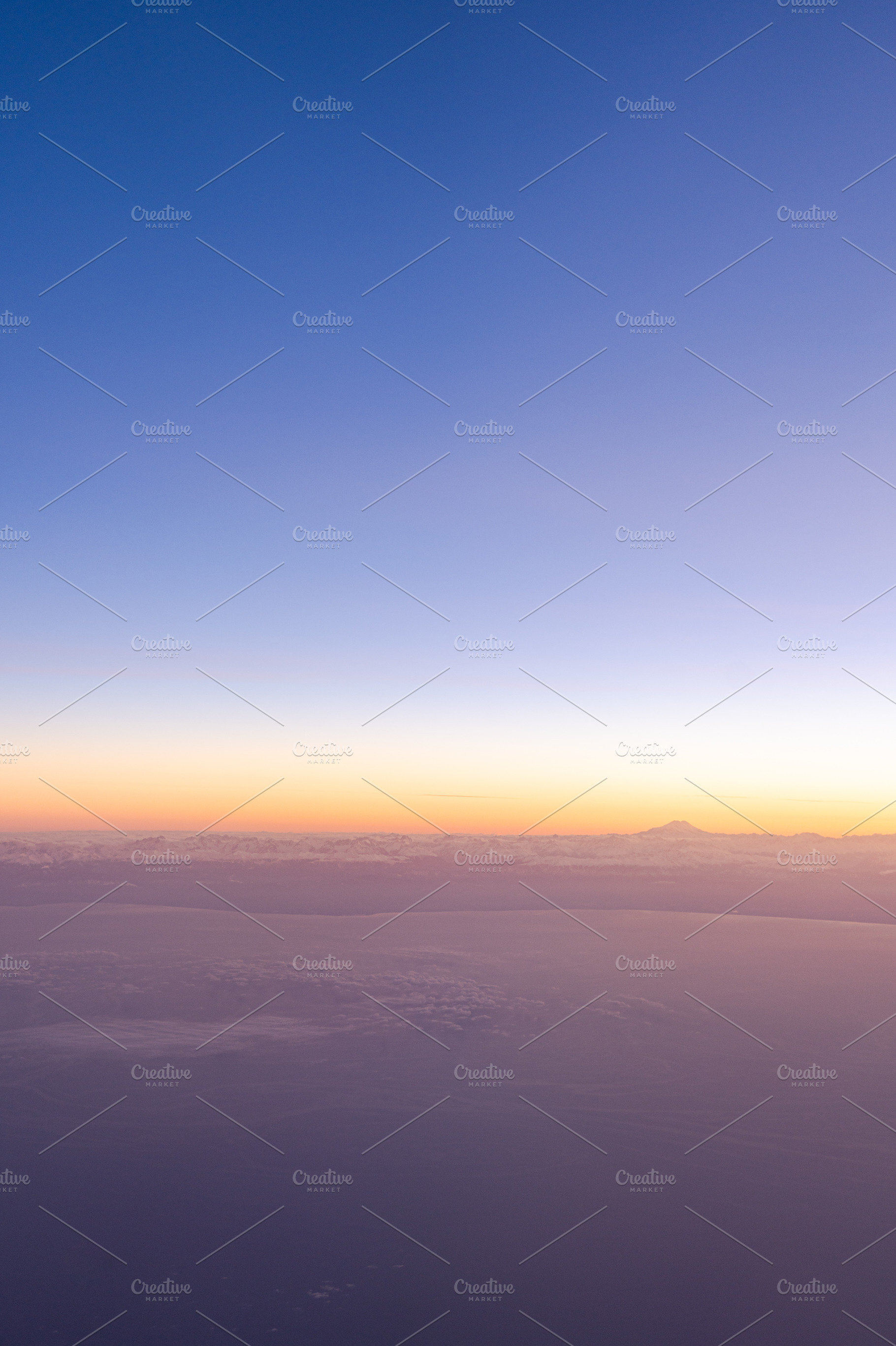 View of Caucasus mountain on the horizon line during sunrise, a Nature Photo by Anna Bogush