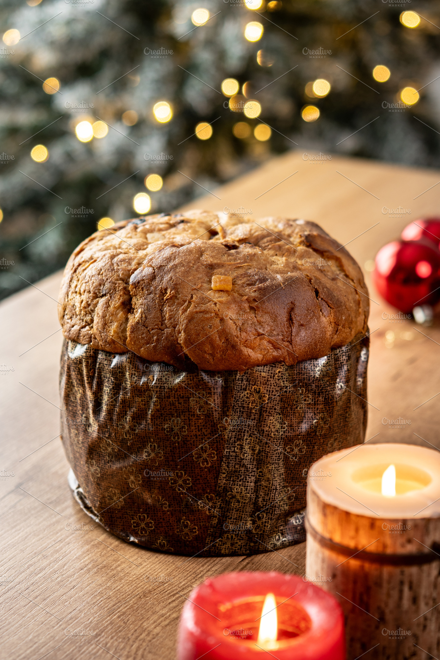 Traditional Italian panettone on wooden table with Christmas decorations, a Food & Drink Photo by etorres69