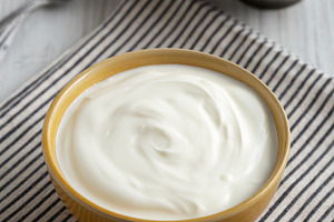 Organic Whole Fat Greek Yogurt in a Bowl, side view., a Food & Drink Photo by LiudmylaChuhunova