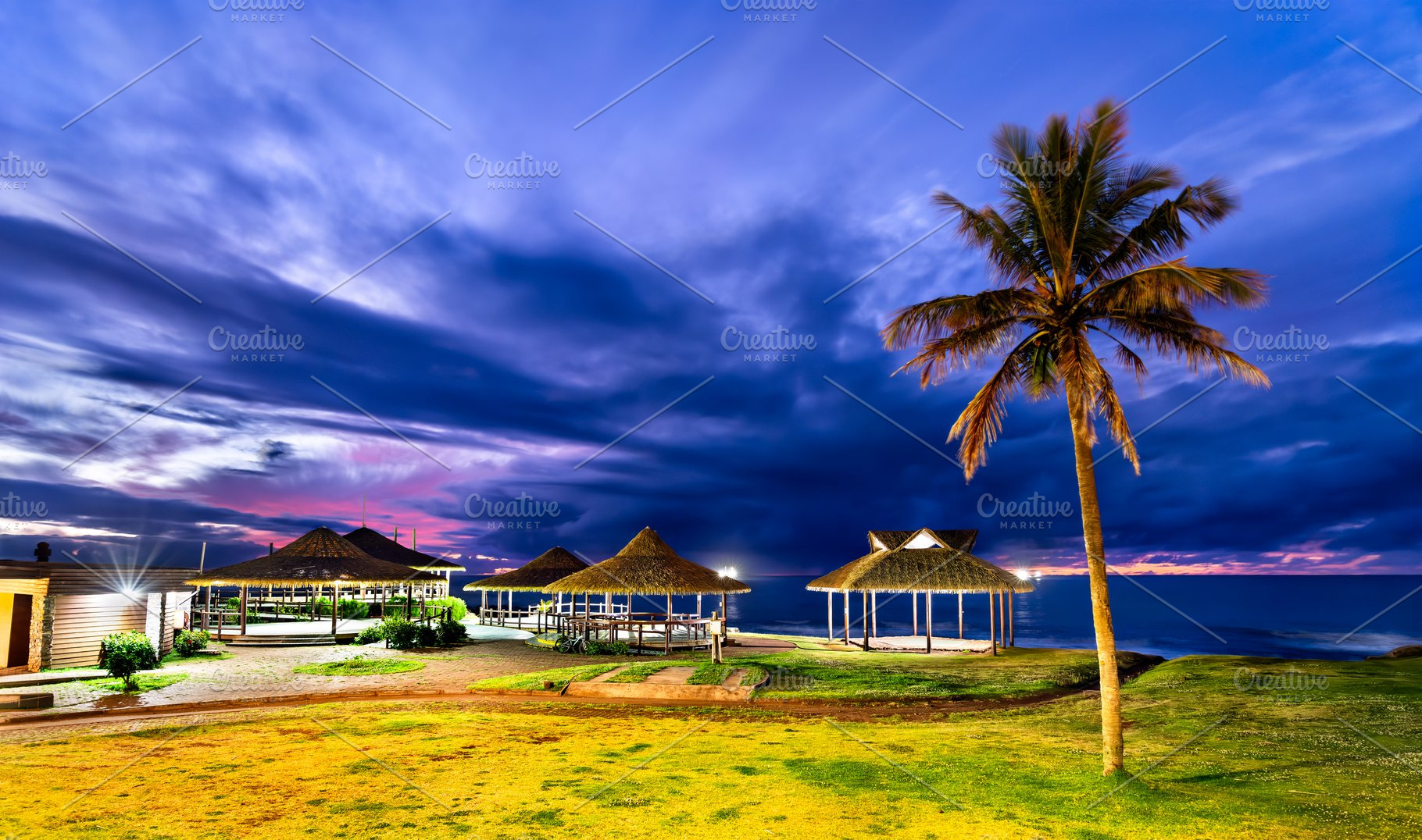 Tropical thatched gazebos at sunset in Hanga Roa, Easter Island, a Nature Photo by Leonid Andronov
