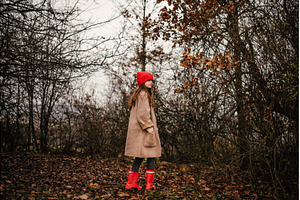 Young girl standing in nature, a Nature Photo by HalfPoint