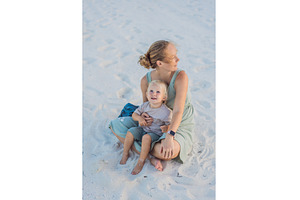Mother and her little son sitting on, a Nature Photo by Elizaveta Galitskaya