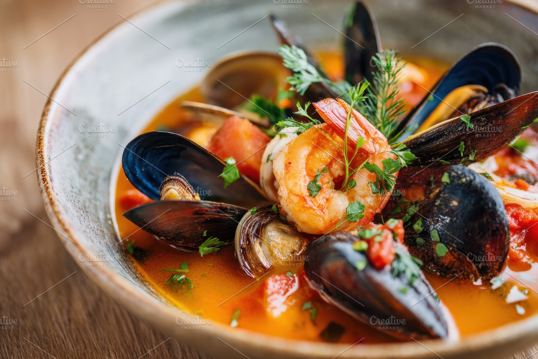 Delicious cooked mussels with lemon and bread, a Food & Drink Photo by AlyaAnd