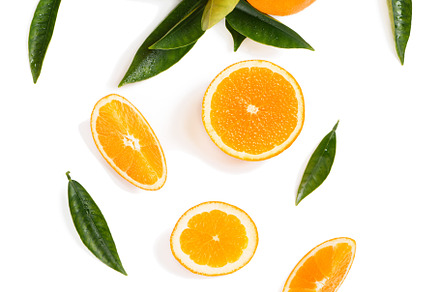 Twig with orange fruits and slices.