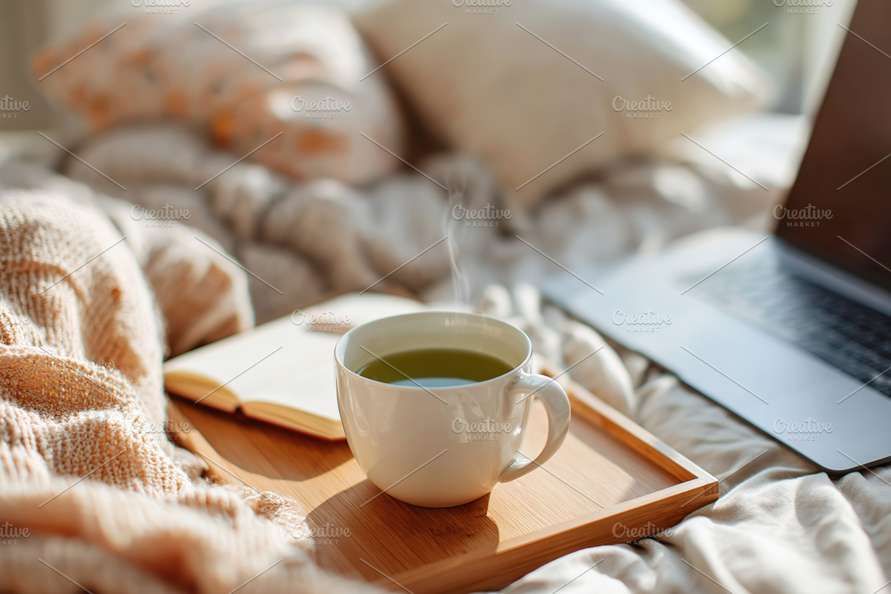 Morning routine of a freelancer enjoying tea in a cozy bedroom setting with lap, a Food & Drink Photo by AlyaAnd
