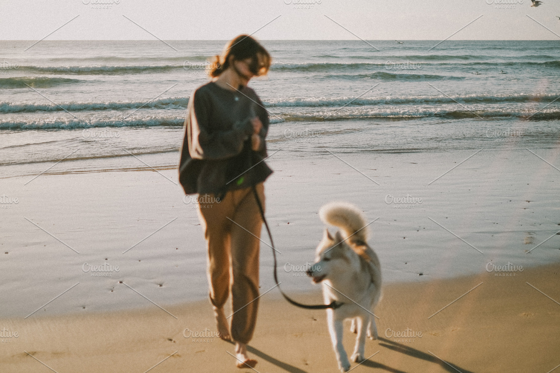 Woman running with a dog, a Person Photo by Valeriia Miller