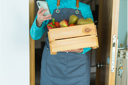Woman with cell phone wooden box, a Food & Drink Photo by Mineko