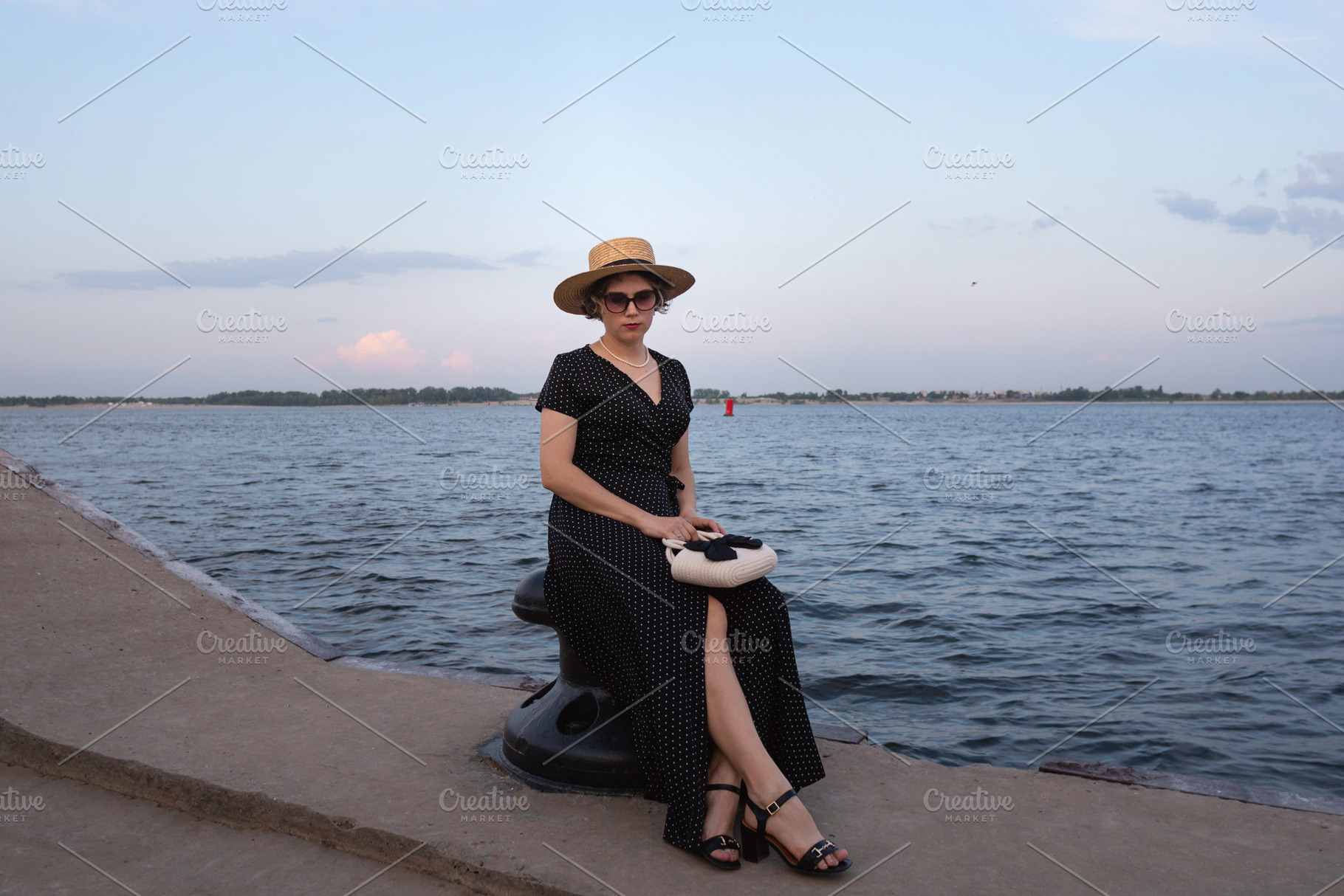 Fashionable woman sits on mooring po, a Beauty & Fashion Photo by Elena Vagengeim
