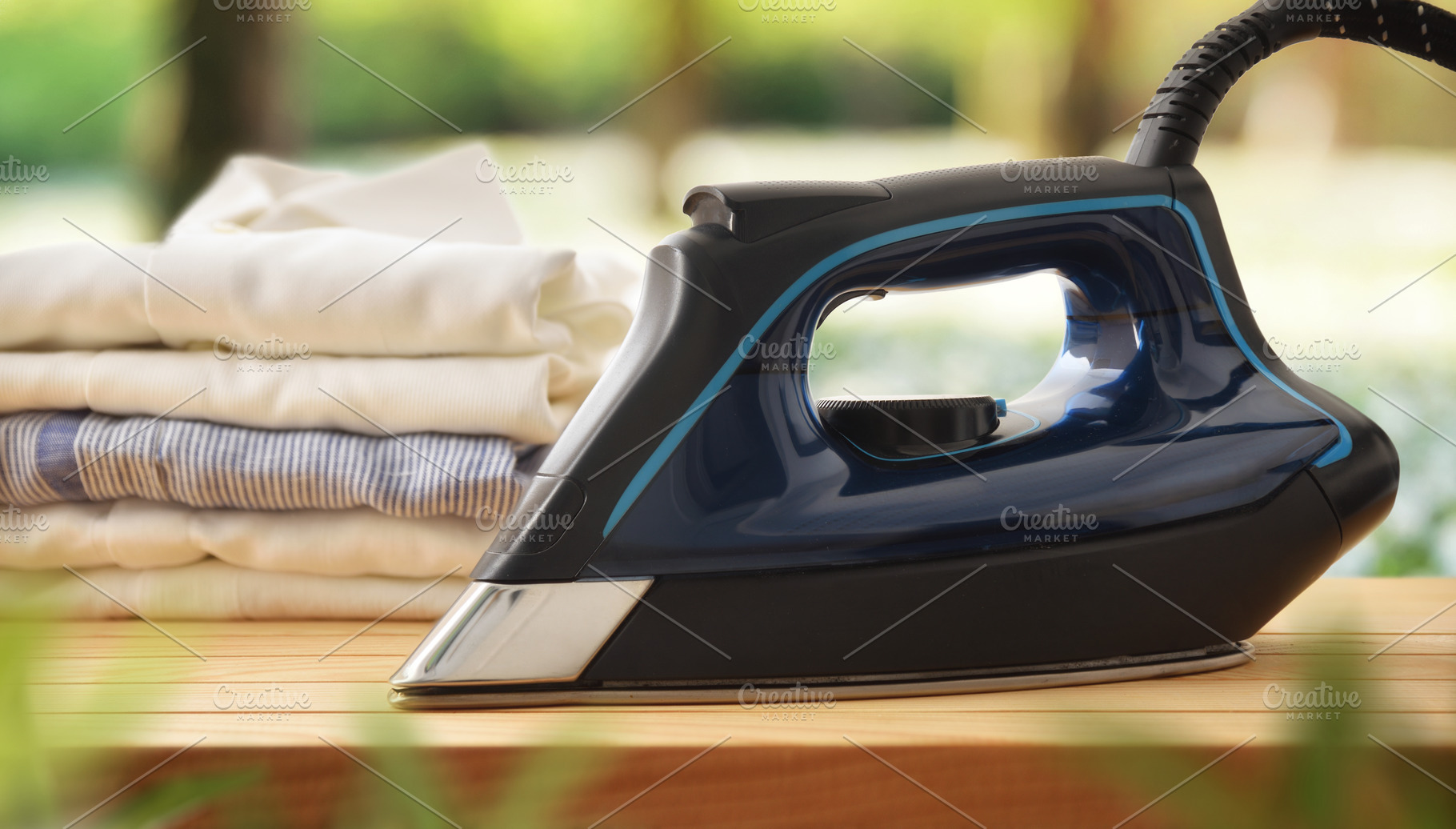 Eco-friendly ironing concept with iron on wooden in nature, a Technology Photo by Davizro's Market