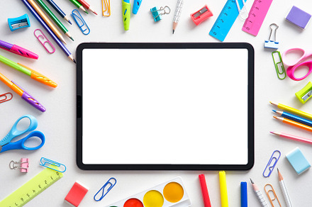 Digital tablet with school supplies, a School & Education Photo by photoguns