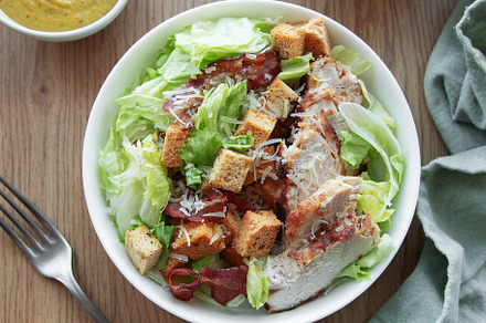 A bowl  of  Caesar salad, a Photo by Olena Rudo