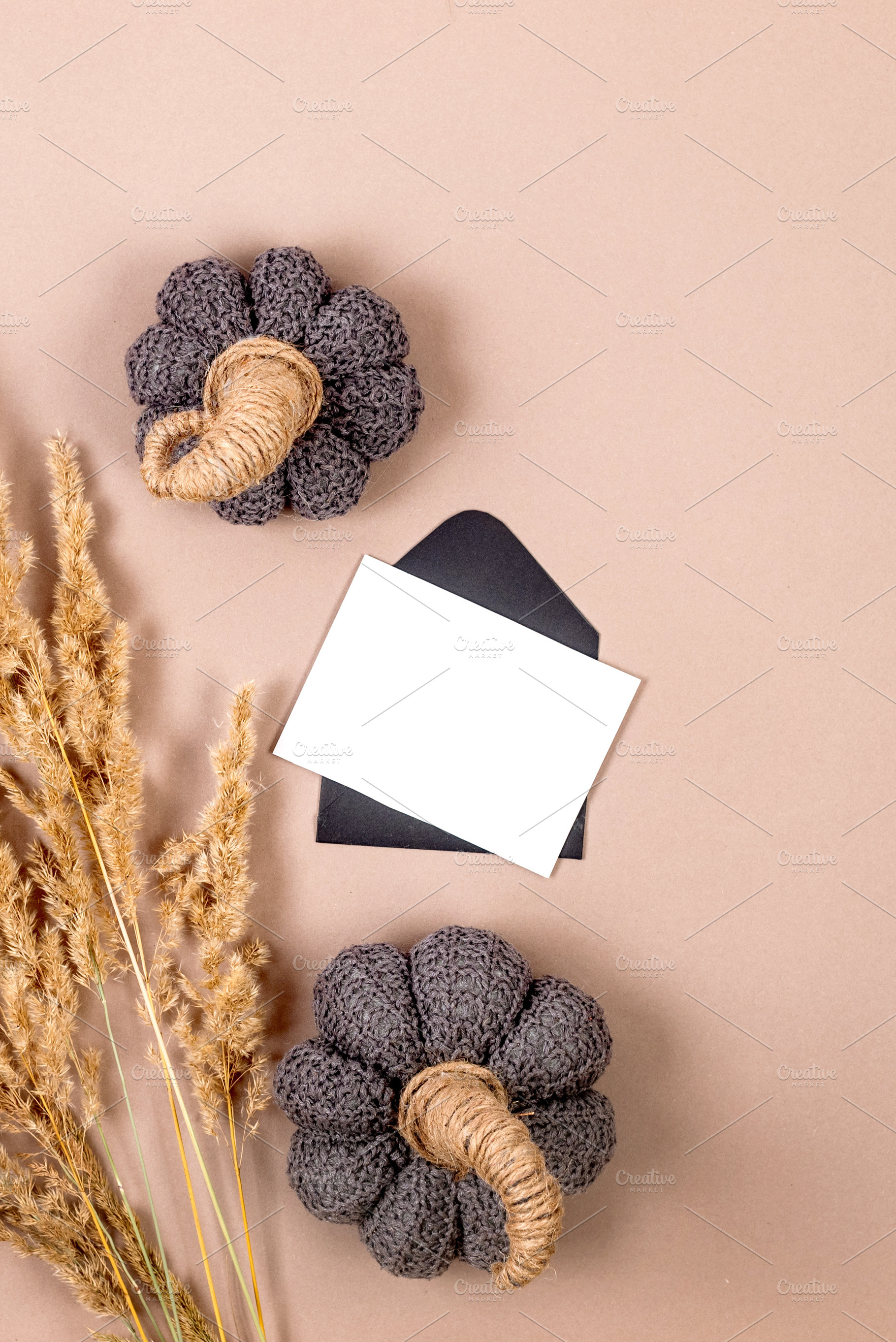 Black envelope with empty white card for text on beige backgroun, a Holiday Photo by vimart