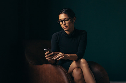 Asian woman using a smartphone in an office, a Person Photo by Jacob Lund