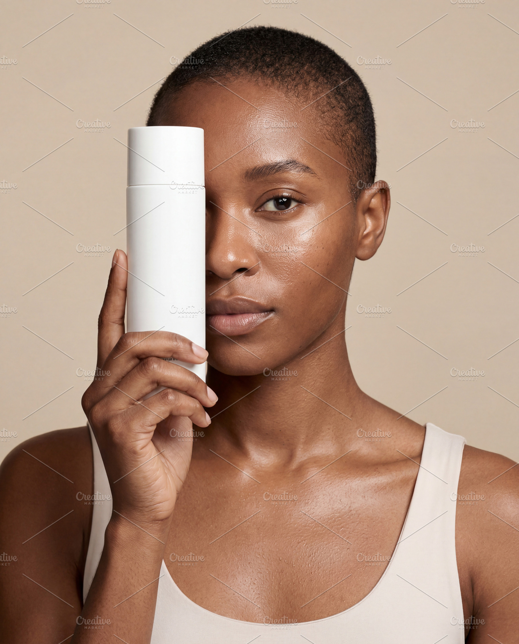 Black woman with skincare bottle, a Beauty & Fashion Photo by Virgo Studio