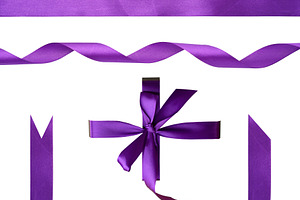 Set of purple satin ribbon elements on isolated background, a Holiday Photo by ndanko