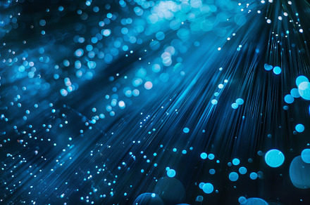 Blue light beams spread across a dar, a Photo by Tanuart