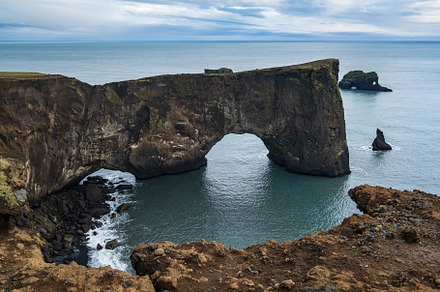 Picturesque autumn evening view to Dyrholaey coast cliffs and ro, a Nature Photo by YuriyB