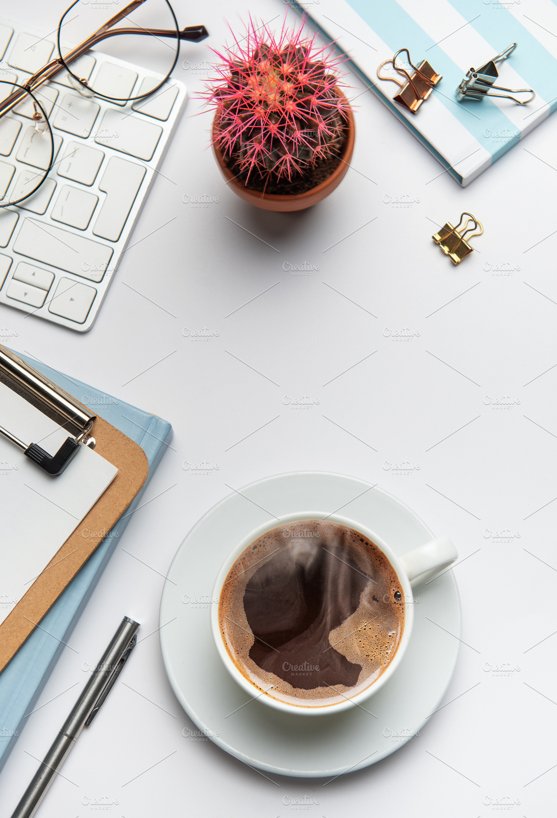 Office worker desk with coffee, keyboard, glasses, plant and not, a Business Photo by Olena Rudo