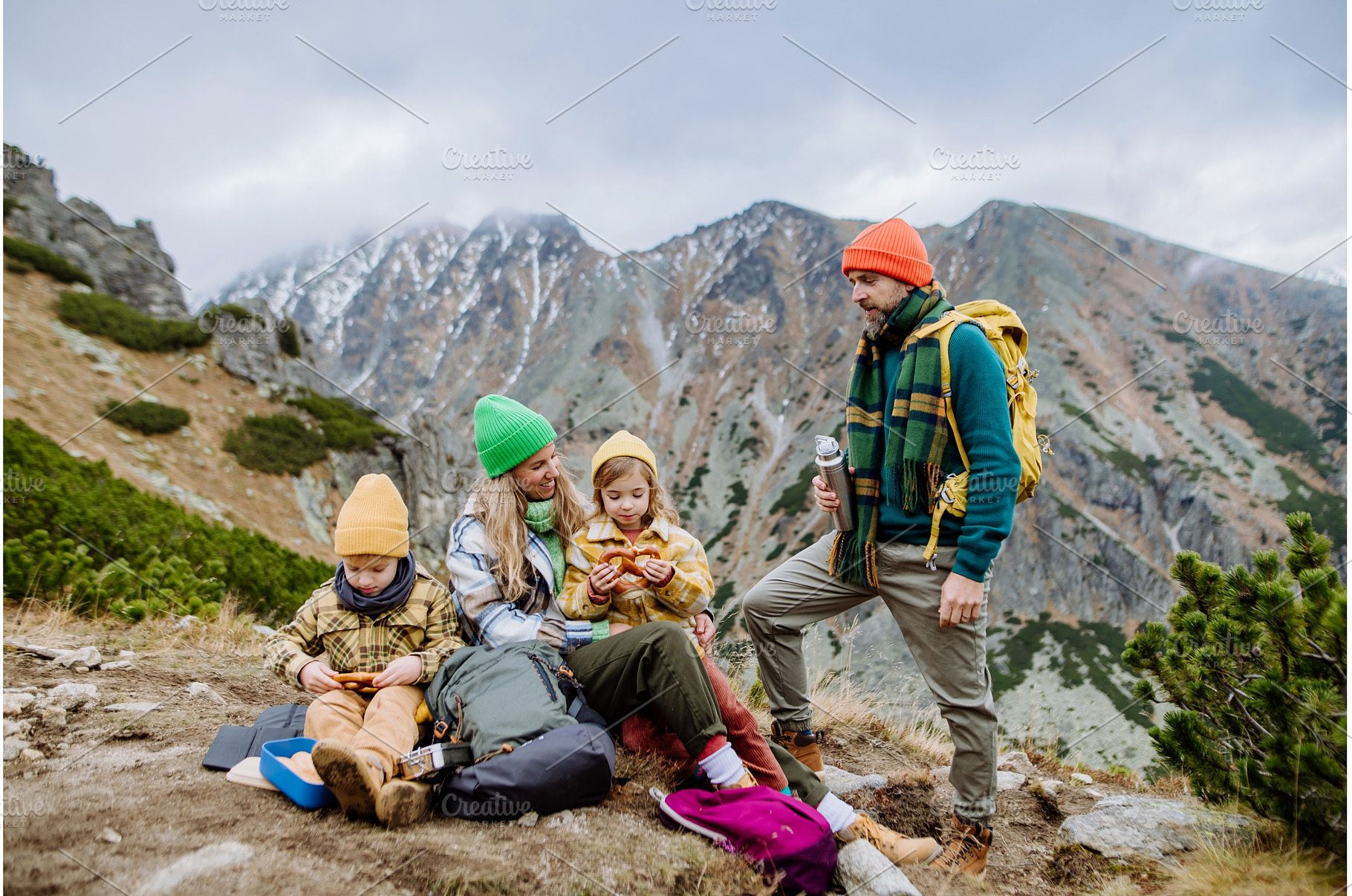 Happy family resting, having snack, a Nature Photo by HalfPoint