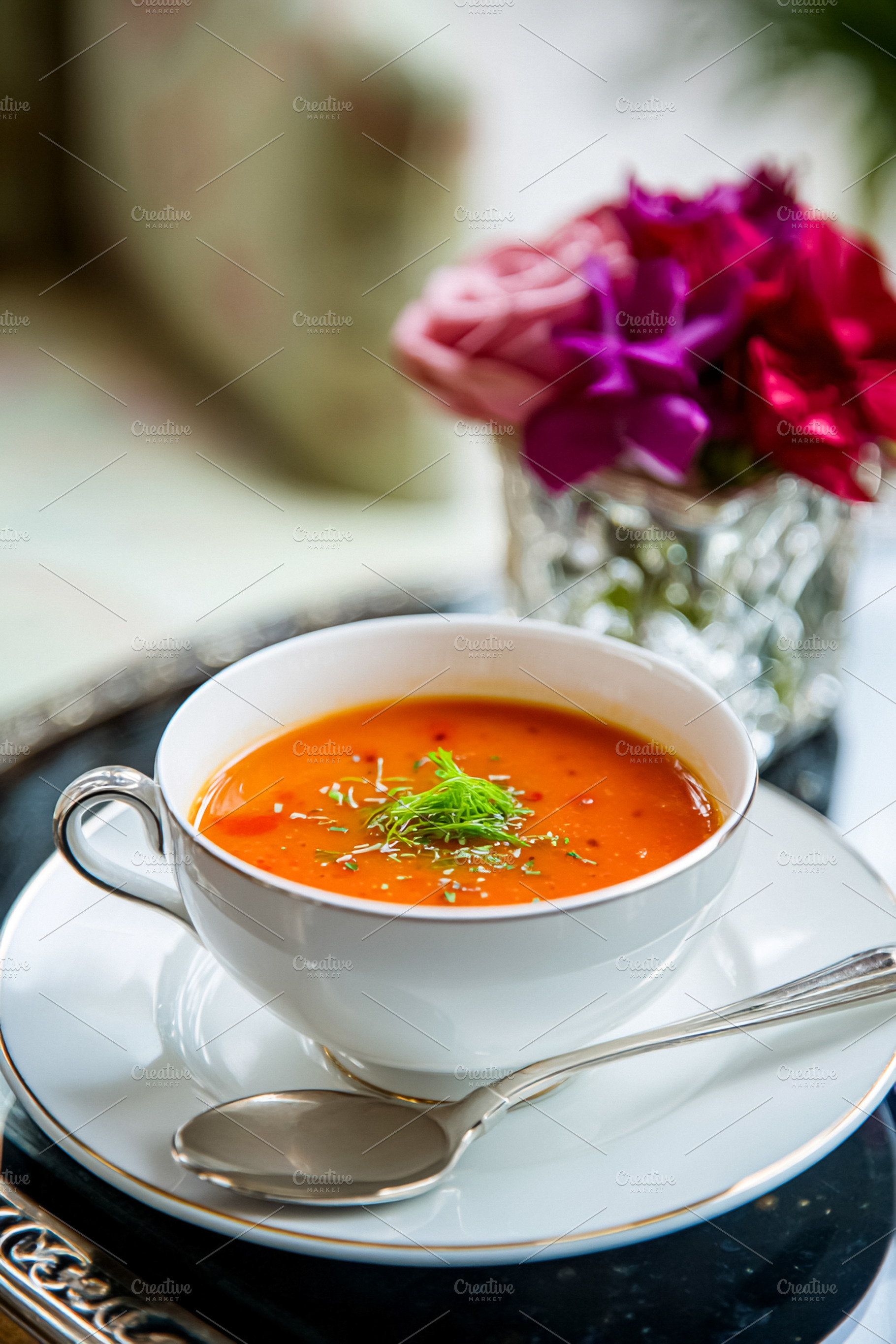 Creamy gourmet tomato soup in an elegant white porcelain cup, ga, a Photo by Studio ANNA