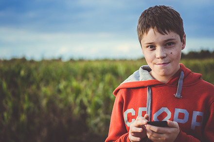 Teen enjoys smartphone containing boy, teen, and phone, a Technology Photo by EVA.studio