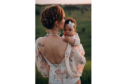 Harmonious family outdoors., a Person Photo by Maksym Zaitsev