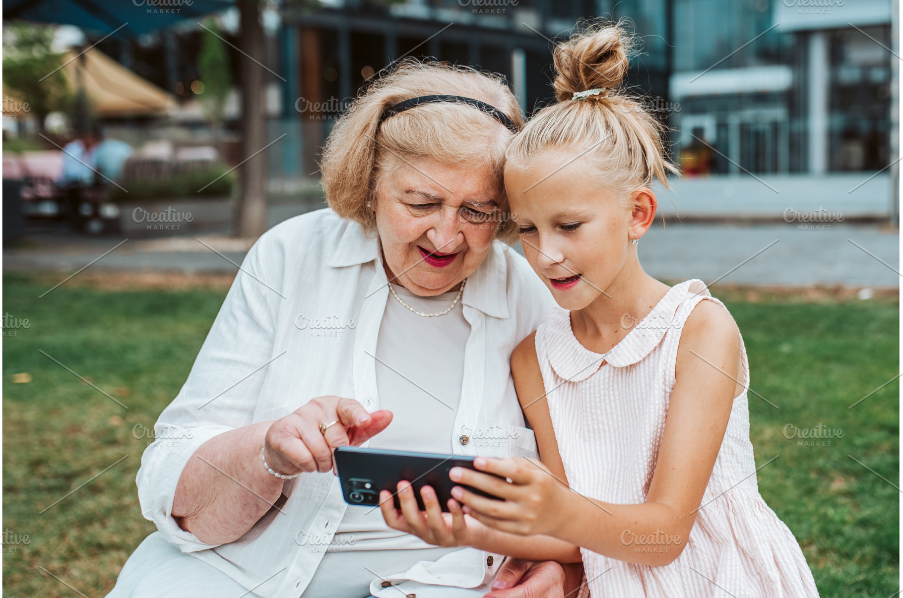 Grandma picking up young girl from, a Holiday Photo by HalfPoint