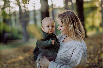 Mother holding her little baby son, a Nature Photo by HalfPoint