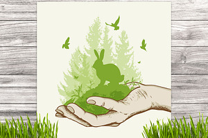 Green tree and rabbit in the hand
