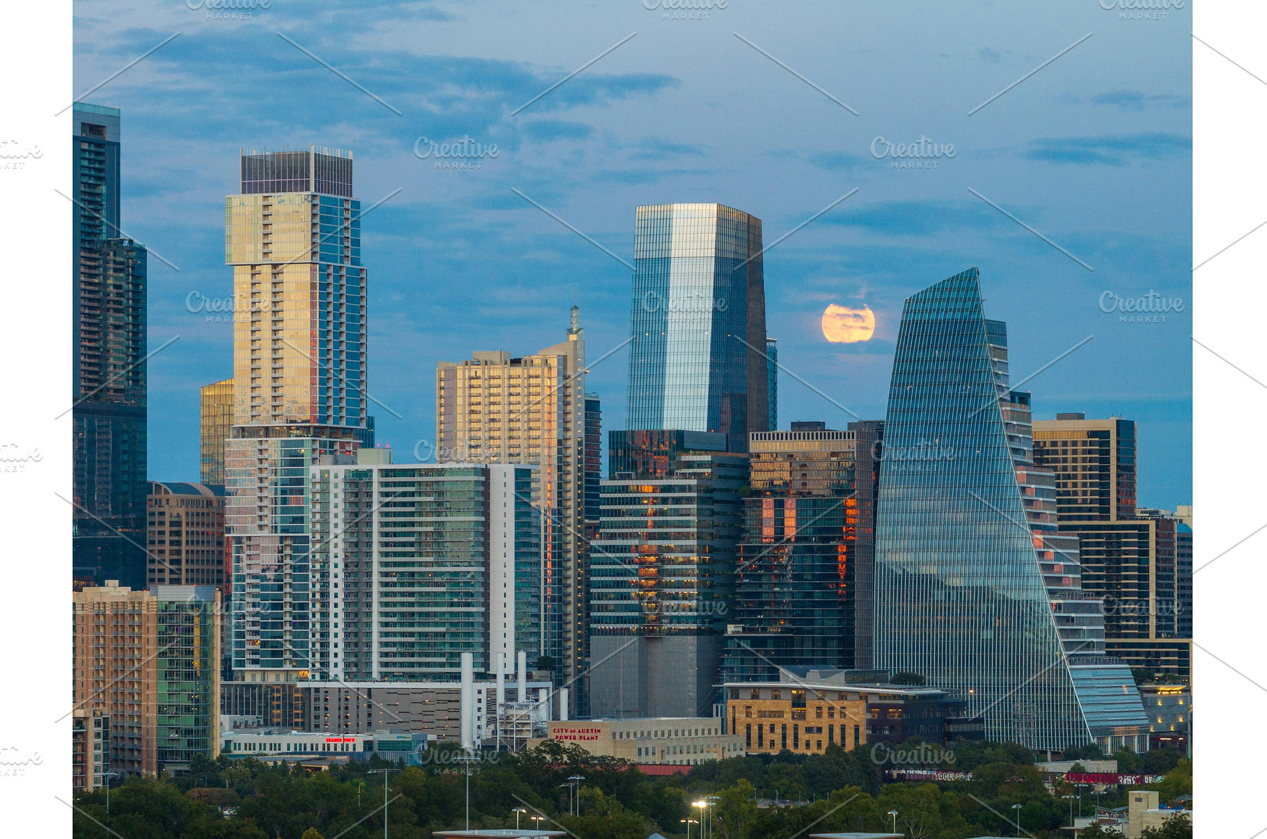 Harvest moon in the Austin skyline, an Architecture Photo by Backyard Stock