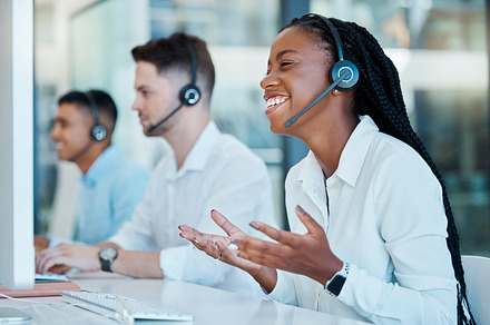 Call center, happy and black woman consulting, working and giving support on the internet with a computer for work in crm. Telemarketing, smile and customer service worker talking for business online, a Photo by Peopleimages.com