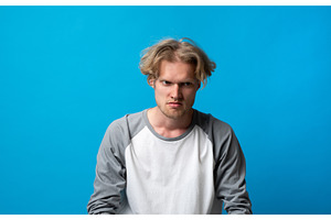 Young man feeling angry and