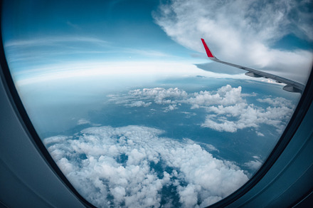 The airplane flew over the clouds., a Transportation Photo by Art Rachen