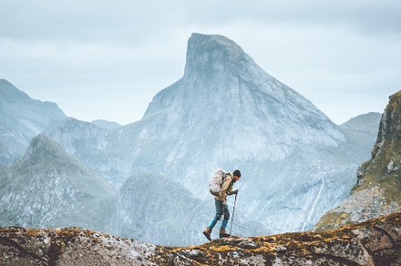 Man hiking in Norway mountains travel with backpack outdoor active vacations he, a Person Photo by e v e r s t