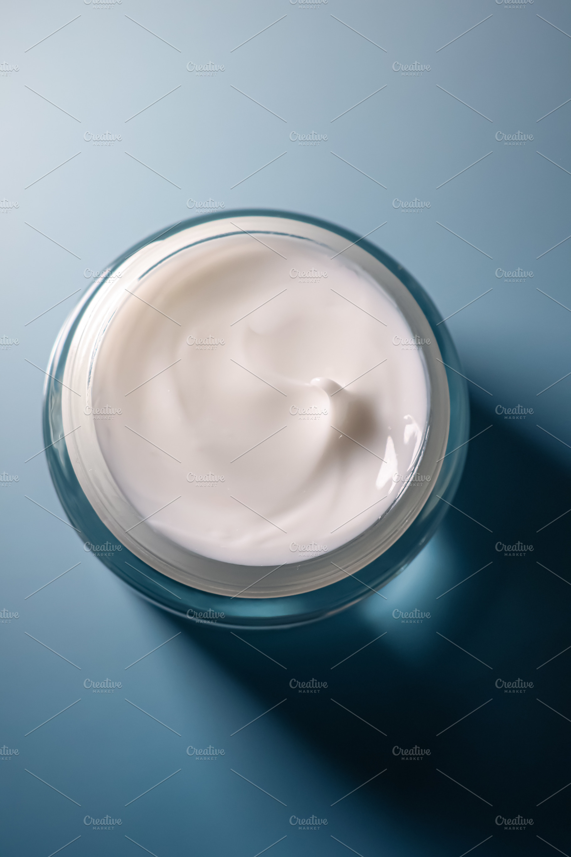 Skincare solution in jar, white face cream for beauty and hygiene routine, pers, a Photo by Studio ANNA