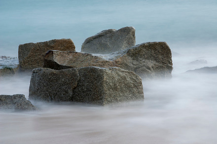 Rocks in the Seashore with a long exposure and silky water, a Nature Photo by RF Images