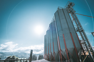 Grain silos at feed mill plant, an Industrial Photo by SkyNext