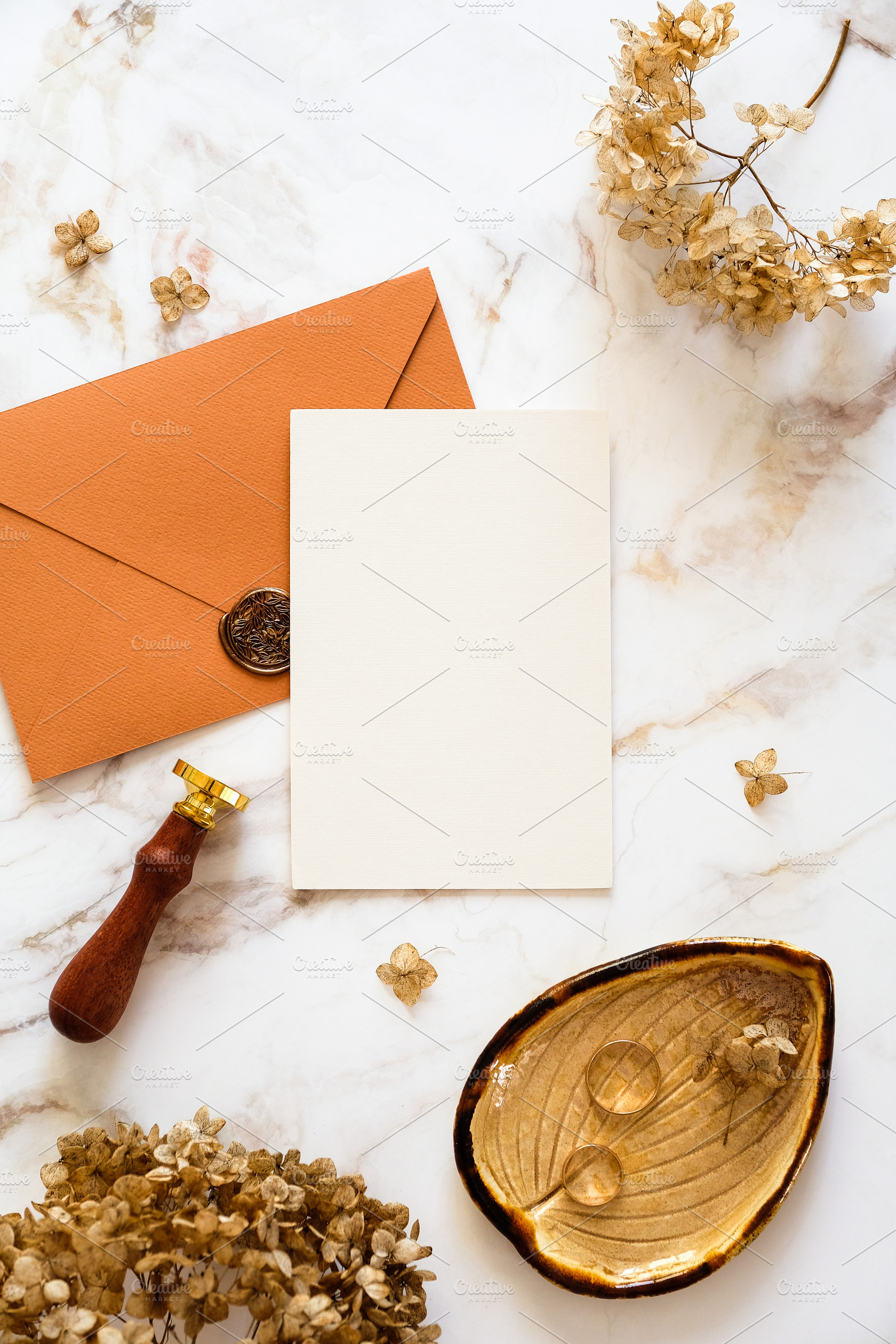 Feminine wedding stationery top view. Blank wedding invitation, bronze envelope, a Holiday Photo by photoguns
