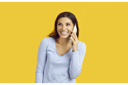 Happy young woman isolated on yellow, a Person Photo by StudioRomantic