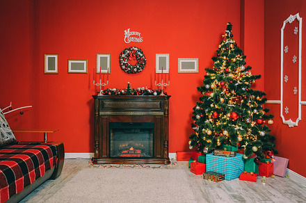 Christmas living room containing room, tree, and defocused
