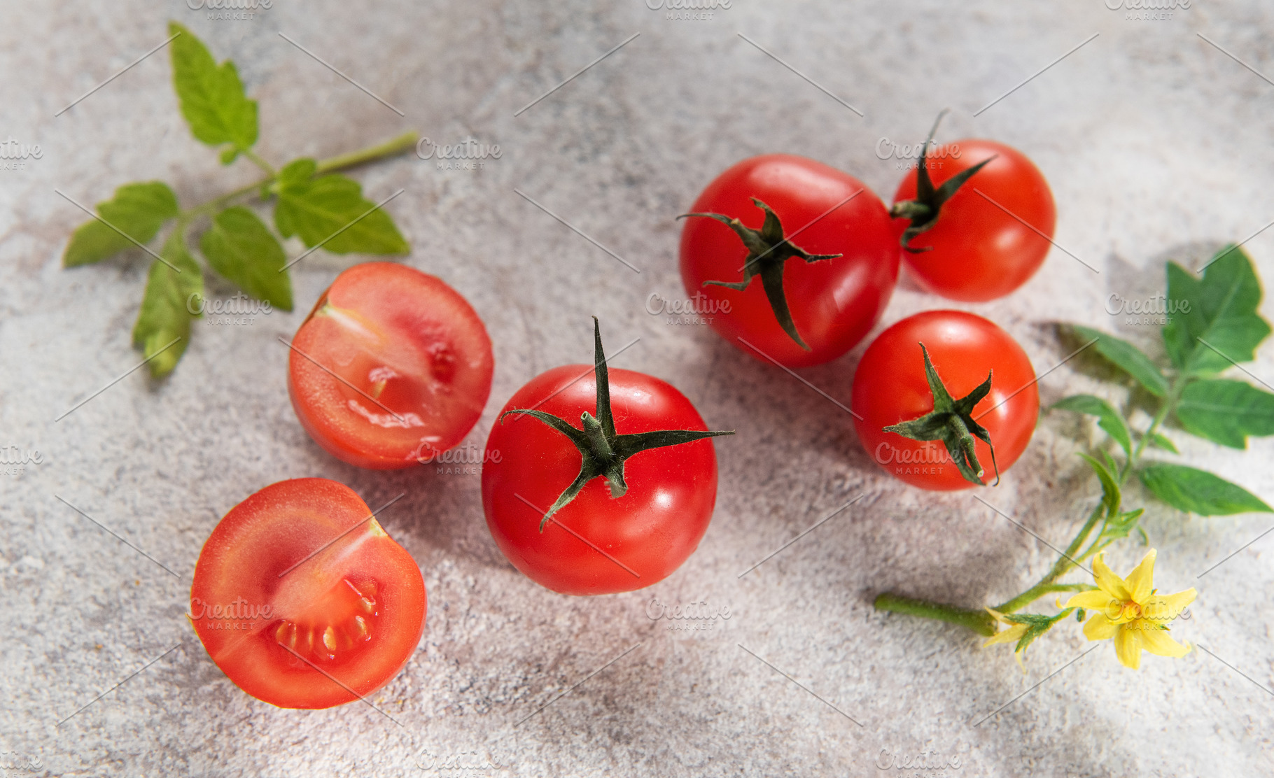 Fresh cherry tomatoes from nature with green leaves, a Food & Drink Photo by Olena Rudo