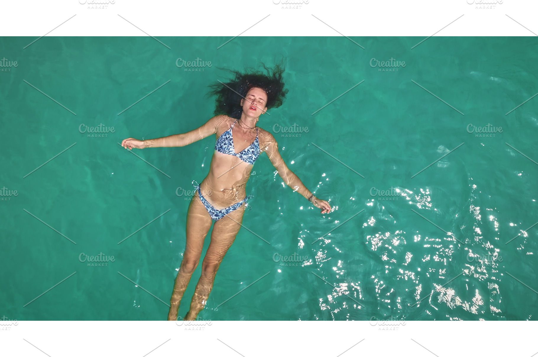 Woman floating peacefully in, a Person Photo by Goinyk