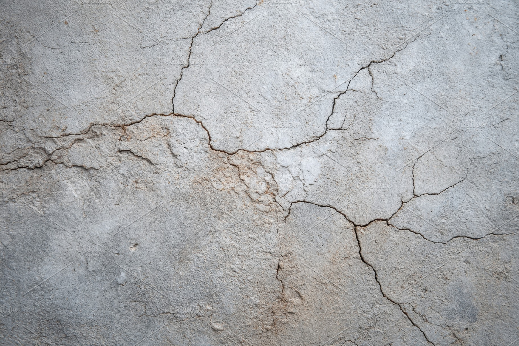 Cracked concrete surface texture, a Background Photo by AlyaAnd
