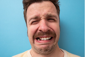 Funny caucasian man crying wipes
