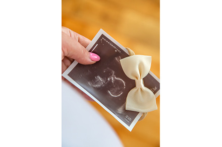 Pregnant woman with girl ultrasound, a Person Photo by yanadjana